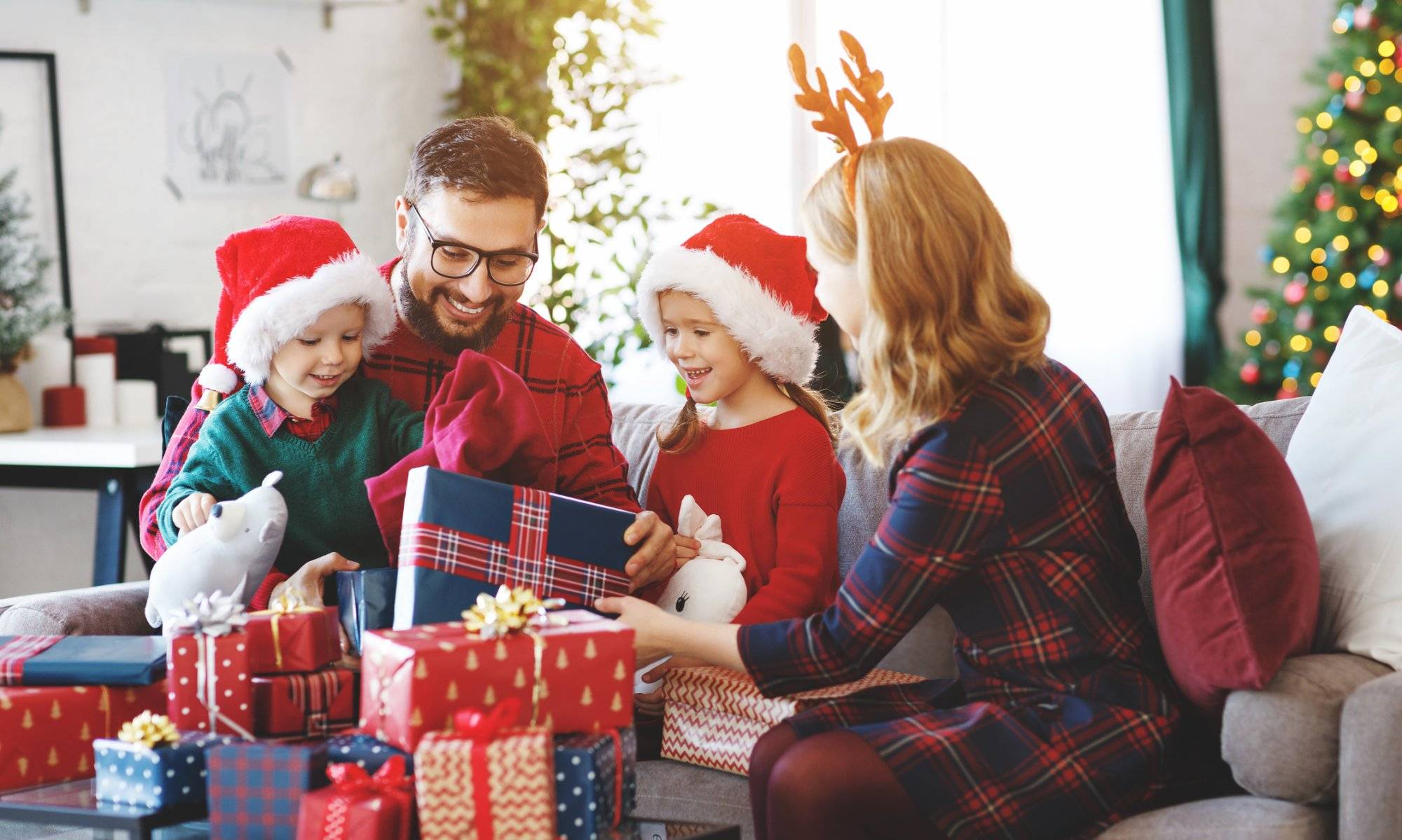 happy family open presents on Christmas morning happy family open presents on Christmas morning
