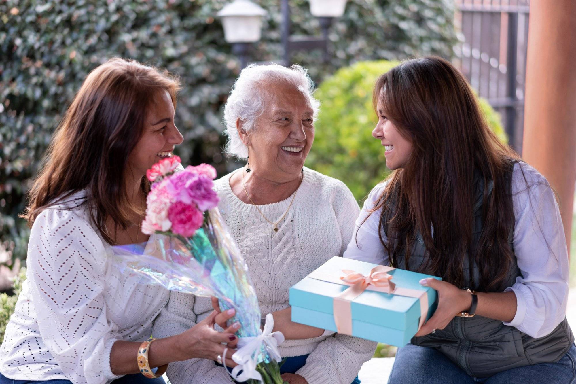 Three generations portrait celebrating motherâs day all smiling very happy Three generations portrait celebrating motherâs day all smiling very happy