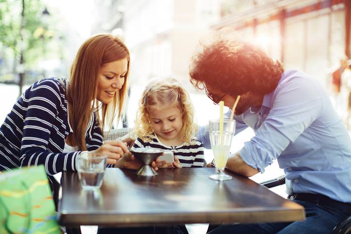 Father And Mother With Their Daughter in Cafe. Father And Mother With Their Daughter in Cafe.